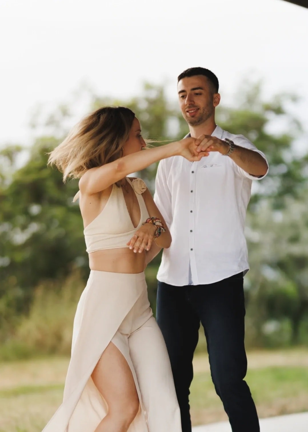 A couple joyfully dancing a Latin partner dance